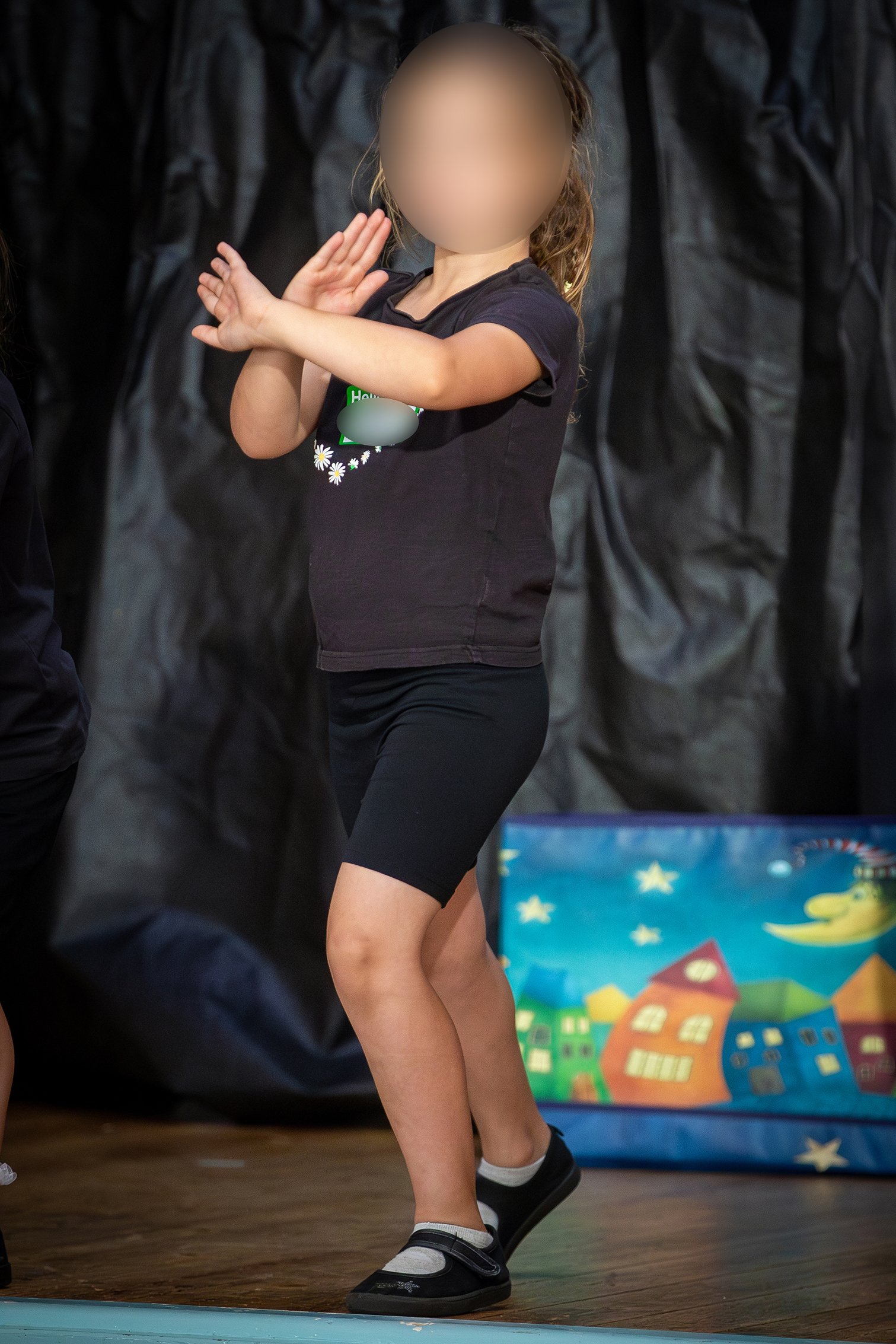 A young performer on stage during the 2024 workshop